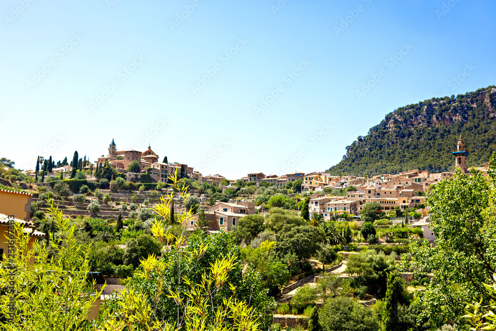 View on city Valldemossa with traditional flower decoration, famous old mediterranean village of Majorca. Balearic island Mallorca, Spain