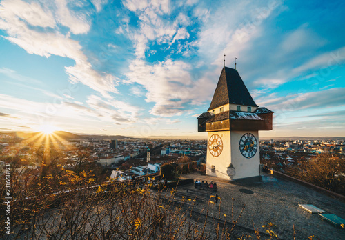 Graz city landmark Schlossberg park tower at sunset and city panorama