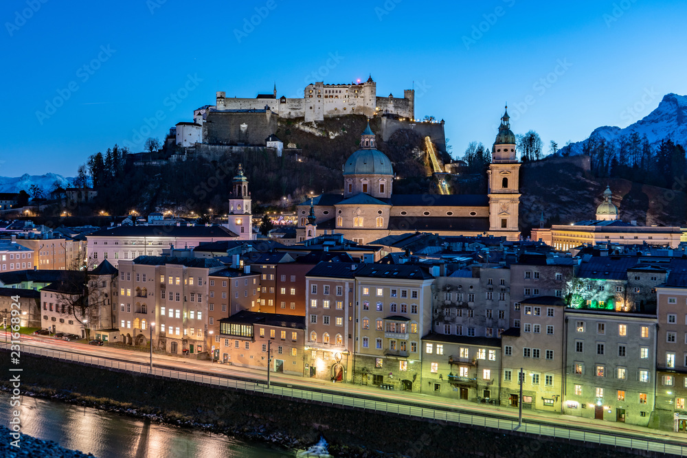 Salzburg by night panoramic view with the Salzburg Fortress and the Cathedral visible