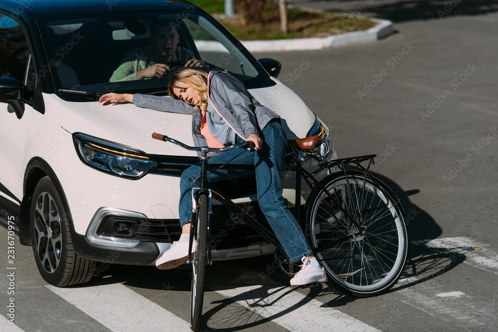 young woman got mowed down by car while driving bicycle on road, car accident concept young woman got mowed down by car while driving bicycle on road, car accident concept