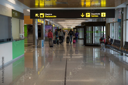 Group of people walking in the terminal of the airpor