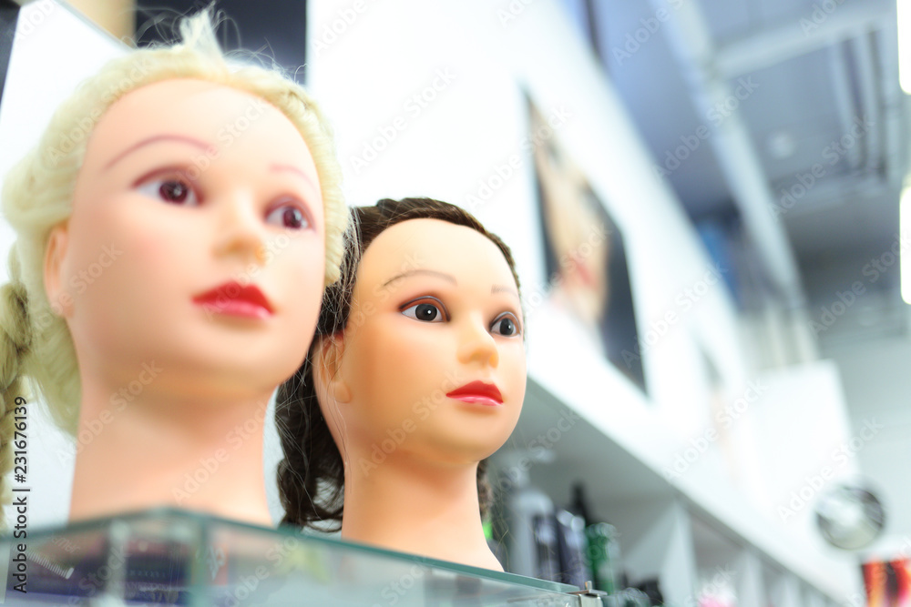 Wigs on mannequins in a beauty salon
