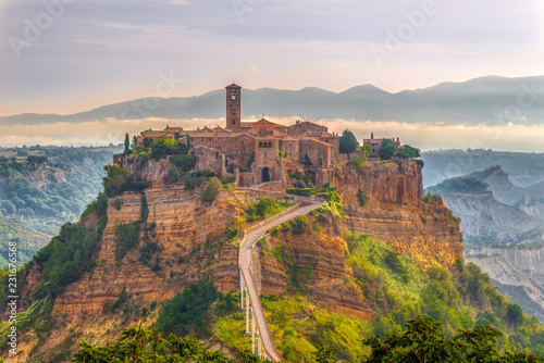 Morning view at the old stone town Civita di Bagnoregio in Italy photo