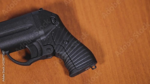 Traumatic Pistols On Wood Backgroud