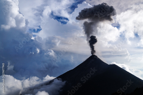 Clouds and ash mix together as Volcano Fuego erupts by daylight. Natural background.