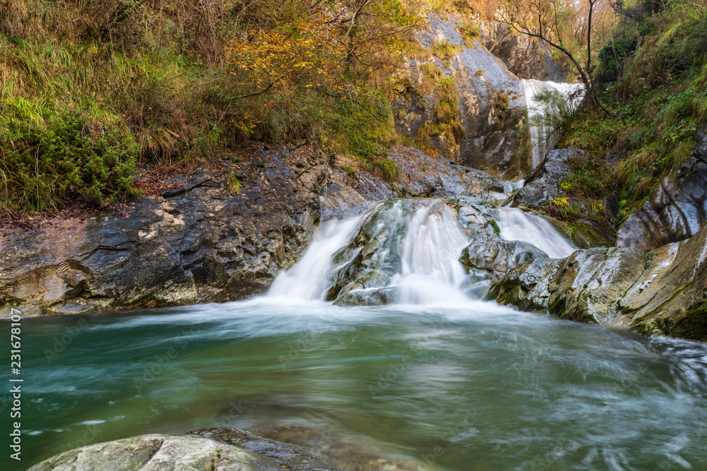 Obraz premium Waterfall and autumn colors. Magic of the Julian pre-Alps.