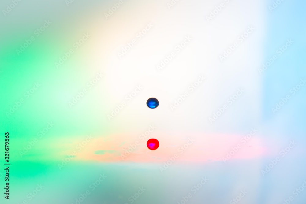 Splash of mixed color liquid with high speed flash Splash of mixed color liquid with high speed flash