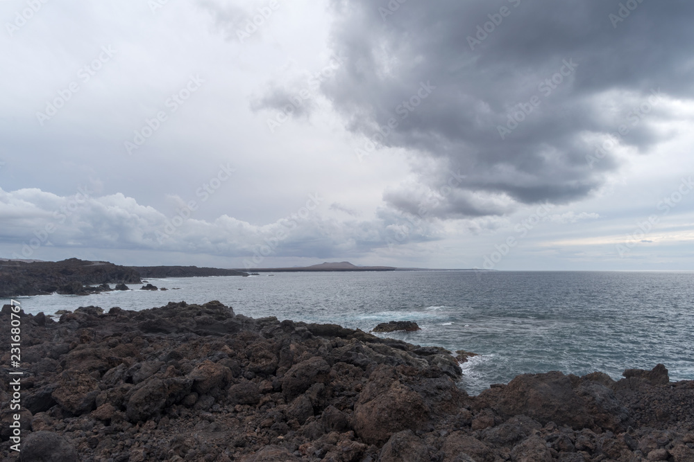 Sea and volcanic coast, Lanzarote Island, Spain Sea and volcanic coast, Lanzarote Island, Spain