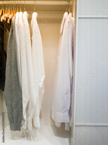 walk -in closet with cloth and shelf at home © YuliiaMazurkevych