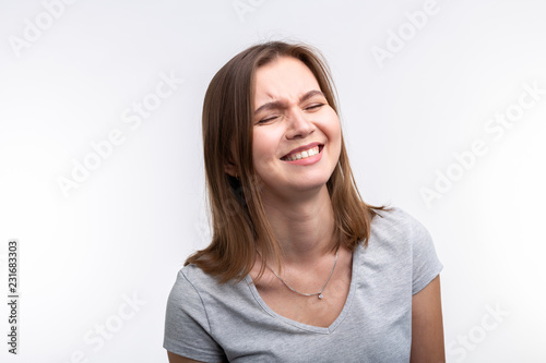 Emotions and people concept - emotional young woman over the white background