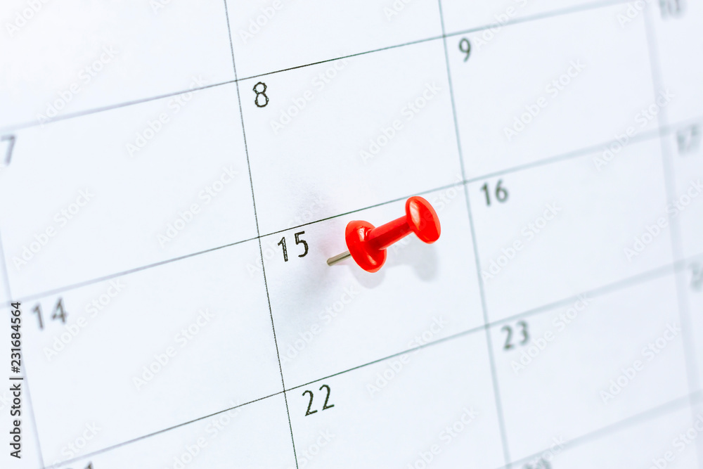 15 date pinning on calendar with Red color pin thumbtack. Save the Date. concept tax day. 15 date pinning on calendar with Red color pin thumbtack. Save the Date. concept tax day.