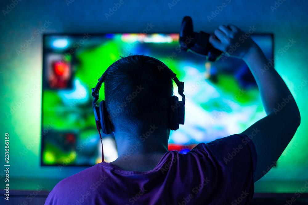 gaming game play tv fun gamer gamepad guy controller video console playing player holding hobby playful enjoyment view concept - stock image gaming game play tv fun gamer gamepad guy controller video console playing player holding hobby playful enjoyment view concept - stock image