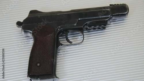 Gun On Metal Background