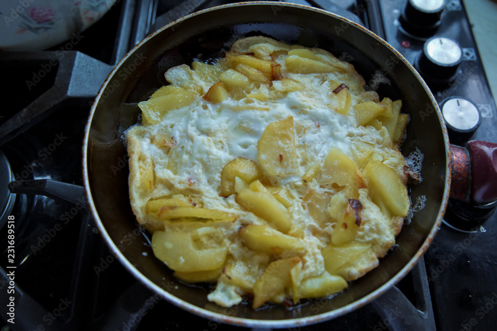 Freid potatoes . Potato fries with egg. Potato fry in the pan with a shellfish.