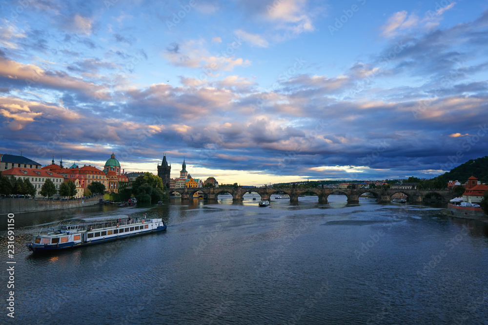 Famous Prague Charles bridge Vltava river with ship Czech republic tourist travel medieval architecture historical landmark