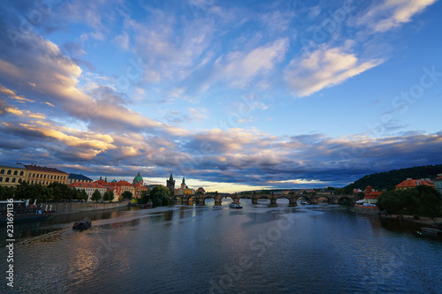 Famous Prague Charles bridge and Vltava river with ships and Old Praha city historic panorama landscape view
