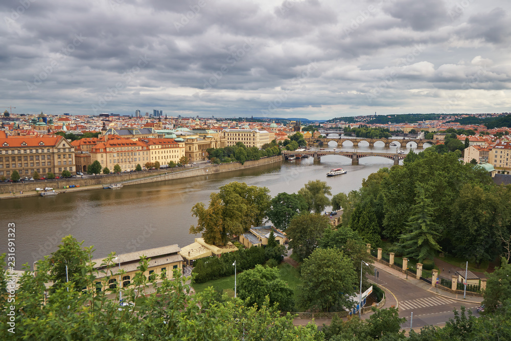 Prague bridges and Charles bridge Vltava river with ships, capital of Czech republic medievil architecture historical landmark