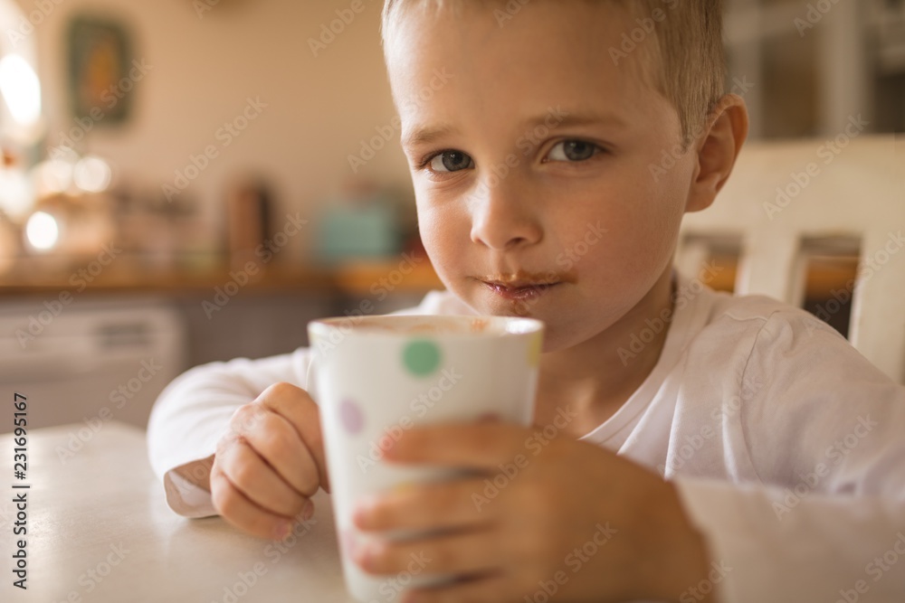 Boy having a cup of drink Boy having a cup of drink