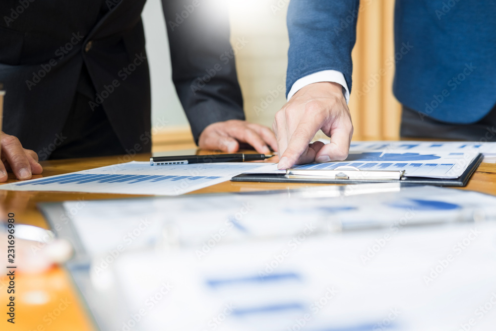 Team work process. young business managers crew working with startup project. laptop in office analyze profit graph plan Team work process. young business managers crew working with startup project. laptop in office analyze profit graph plan
