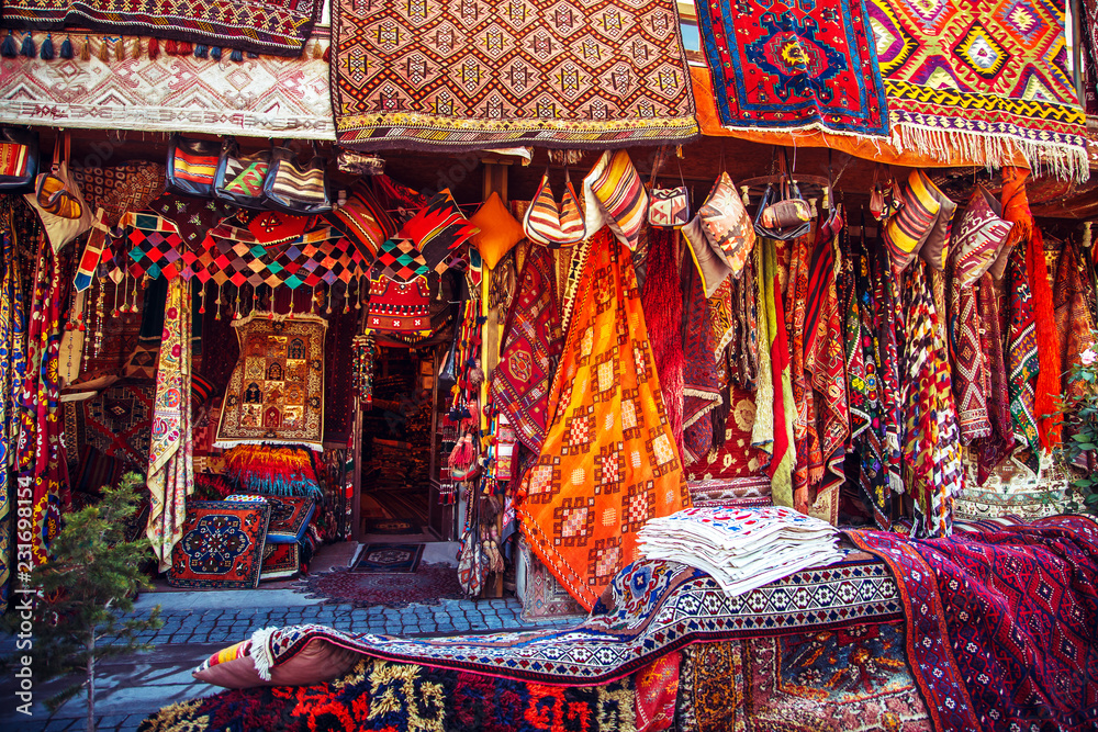 Amazing traditional handmade turkish carpets in souvenir shop. - obrazy, fototapety, plakaty 