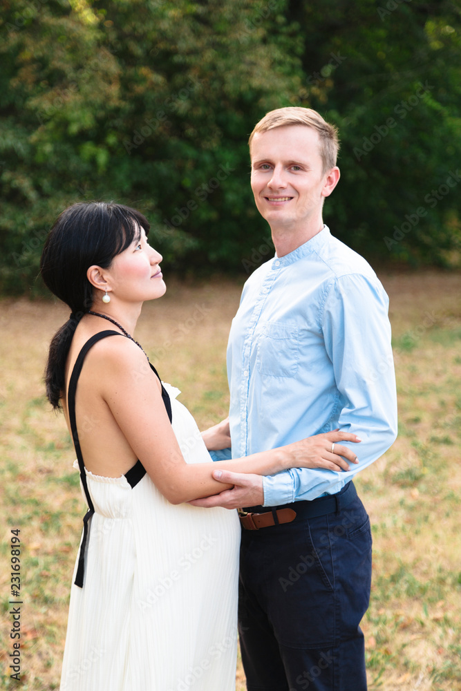 International young romantic couple holding hands outdoor International young romantic couple holding hands outdoor