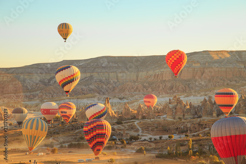 Amazing sunrise over Cappadocia. Colorful hot air balloons.