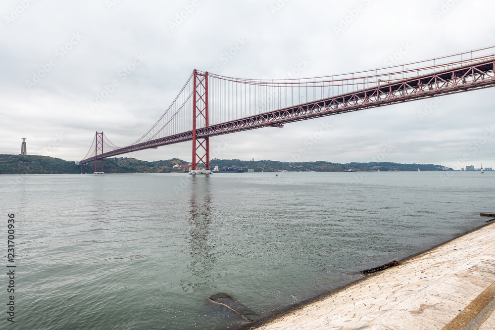 Fototapeta premium 25th April Bridge in Lisbon on a cloudy day
