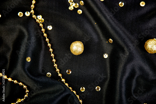 Luxury black background with gold  shiny balls.