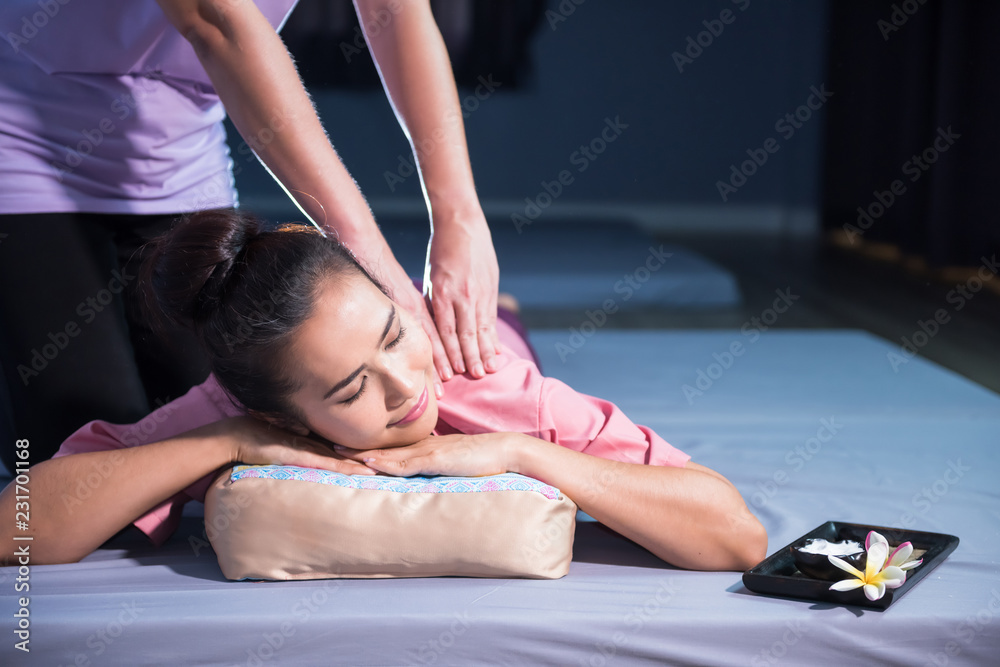 Fototapeta premium Thai massage to Asian woman in spa