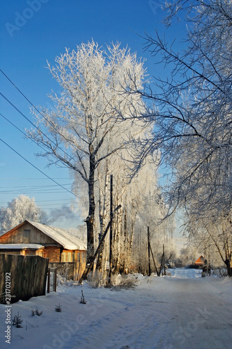snowy village street on a frosty winter day