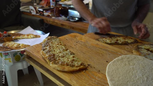 Lebanese bakery (forn) doing special mankouche egg with awarma photo