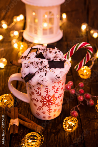 Christmas cup with hot chocolate and whipped cream.
