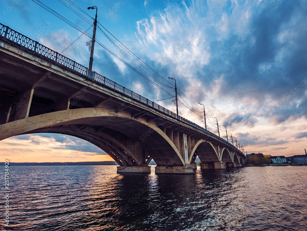 Vogres Bridge panorama over Voronezh river at dramatic sunset background