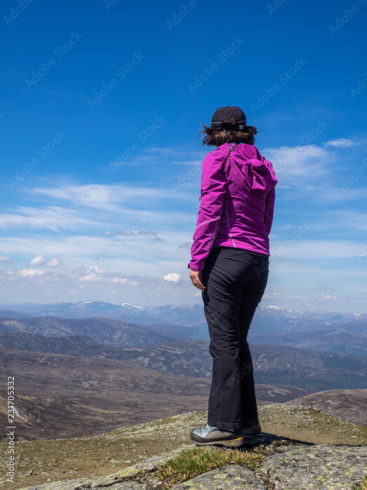Mature adult female hiking in Scotland
