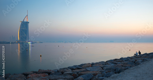 DUBAI, UAE - MARCH 30, 2017: The evening skyline with the Burj al Arab and Jumeirah Beach Hotels.