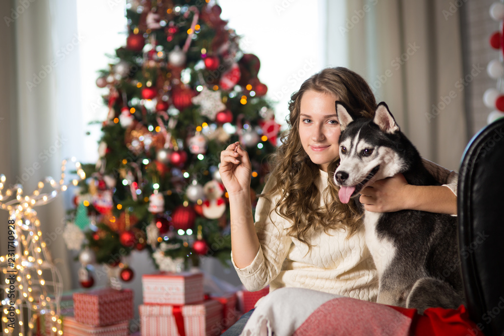 Obraz premium Teen girl with dog , for Christmas