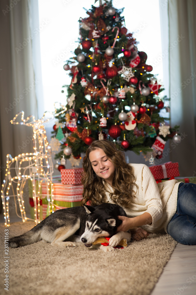 Obraz premium Teen girl with dog , for Christmas