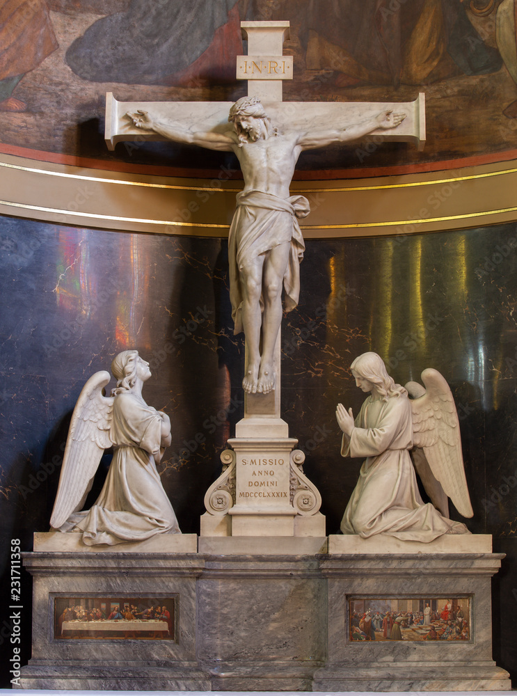 PRAGUE, CZECH REPUBLIC - OCTOBER 13, 2018: The marble Crucifixion in church kostel Svatého Václava by  artvork prof. Suchard and made by Čeněk Vosmík (end of 19. cent).