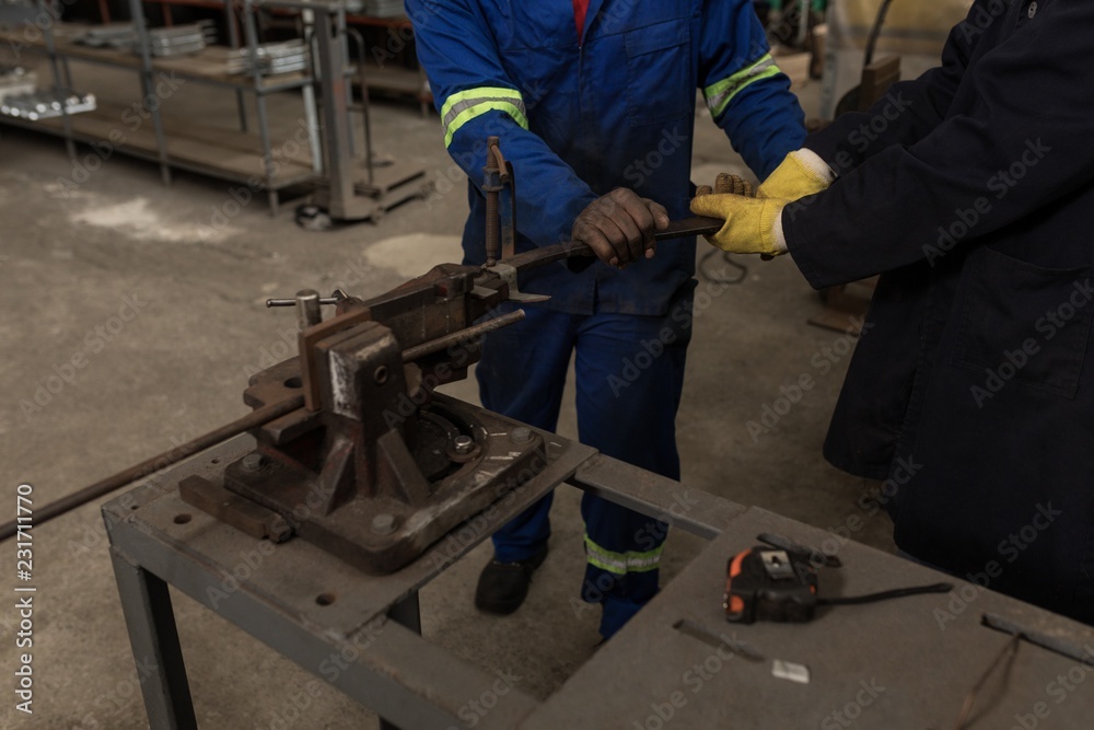 Blacksmith working in workshop Blacksmith working in workshop