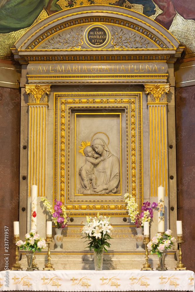 PRAGUE, CZECH REPUBLIC - OCTOBER 13, 2018: The altar and marble relief of Madonna in church kostel Svatého Václava by artwork F. Sequens  made in italian Luisi workroom (beginn of 20. cent).