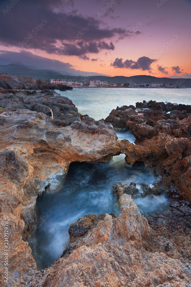Obraz premium Amazing hidden beach and rocks in Milatos, Crete, Greece during sunset.