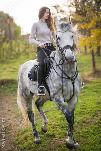 Young woman with a horse © Evgenia Tiplyashina