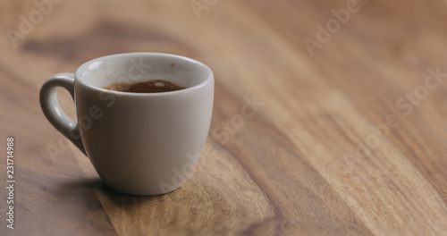 cup of fresh espresso on wood table