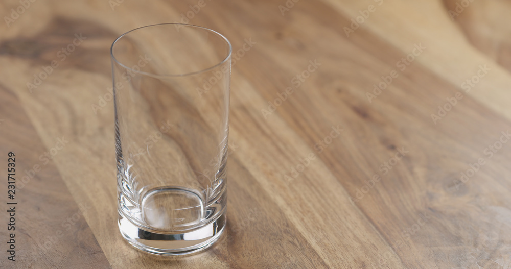 empty glass on wood table empty glass on wood table