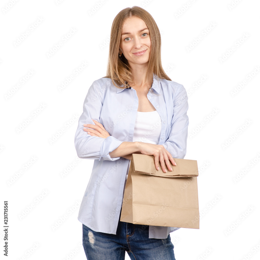 Woman holding a paper bag package shopping beauty on a white background. Isolation Woman holding a paper bag package shopping beauty on a white background. Isolation