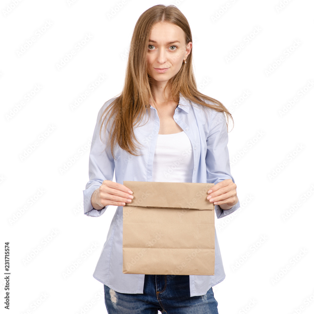 Woman holding a paper bag package shopping beauty on a white background. Isolation Woman holding a paper bag package shopping beauty on a white background. Isolation