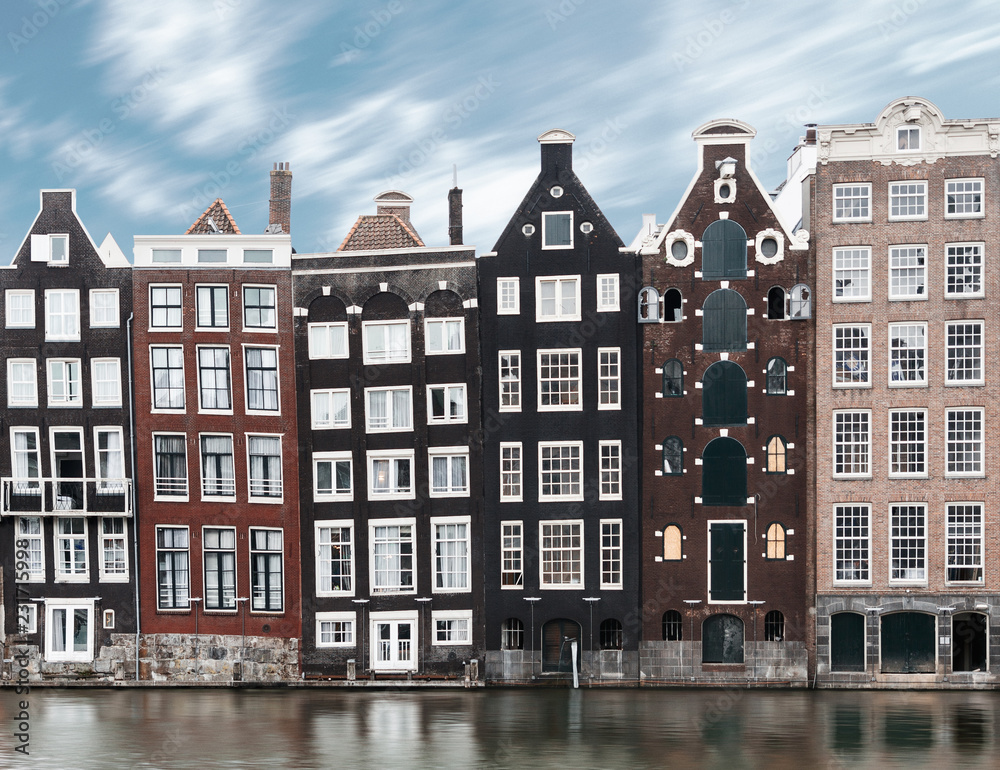 Long exposure picture of traditional Amsterdam old town architecture