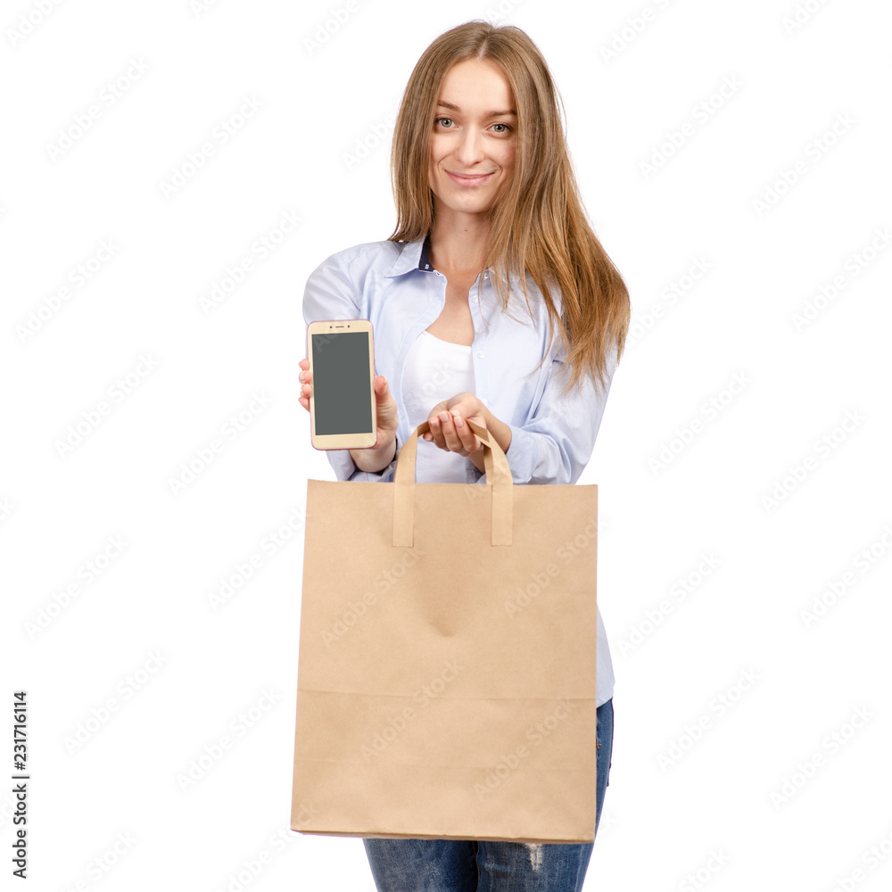 Woman holding a paper bag smartphone mobile phone shopping beauty on a white background. Isolation Woman holding a paper bag smartphone mobile phone shopping beauty on a white background. Isolation