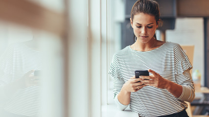 Businesswoman using mobile phone