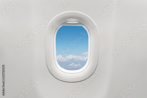 Isolated airplane window with blue sky